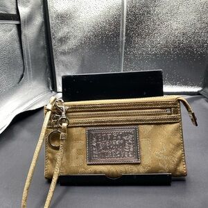 666Coach gold Poppy wristlet Preowned